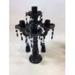 A black - painted - glass table candalabra oth additional pieces H:42cm