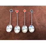 A set of Walker and Hall silver tea spoons with enamelled top depicting he four card suits.