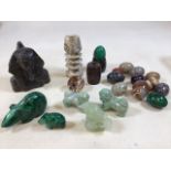 Two malachite animals and eggs with other mineral specimen eggs and carved stone items