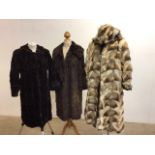 Three fur coats. One with hood and reversible to leather coat. One is A/f condition - see photo