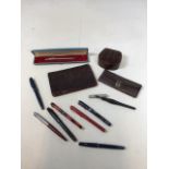 A quantity of pens including Onoto, The Pen, Swan, Parker, Osmiroid also with small leather