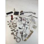 A quantity of costume jewellery and other items including mother of pearl counters, penknives, white
