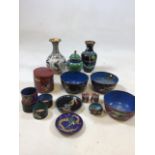 A quantity of cloisonne items including 2 vases H:17cm, 3 bowls, a cannister, napkin rings and other