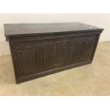 An elm blanket box with attached carved panel front with interior candle box. W:89cm x D:42cm x H:
