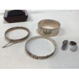 Three silver bangles total weight 93gm, also with a pair of silver and 9ct gold cuff links