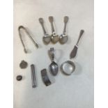 Silver items total weight 148gm. Includes,sugar tongs, spoons, napkin ring and others