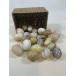 A collection of mineral eggs in a basket.