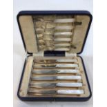 A set of Mappin and Webb silver fruit knives and forks with mother of pearl handles - damage to
