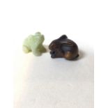 A wooden carved Netsuke of a rabbit, signed to base, also with a carved jade frog W:5cm x D:3cm x
