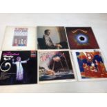 A box of vinyl albums including Roger Daltrey, Suzanne Vega, Jonnie Cash, Lynn Anderson, Gene