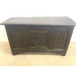 A carved oak coffer. W:123cm x D:50cm x H:72cm