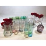 Six red hock glasses, six red sundae dishes, coloured glass tumblers and other glasses items