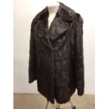 A vintage fur long line jacket. Repot needed to one elbow - see photo