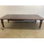 A Large extending mahogany dining table with three leaves. With Joseph Fitter Patentee extending
