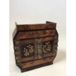 A table top Chinese style cabinet with hand painted decoration and decorative metalwork. A/F W: