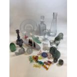 A mixed quantity of glass items including decanters, paperweights, Murano sweets and other items