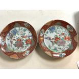 A pair of 19th century oriental plates with six character marks.