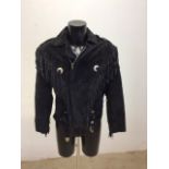 A vintage black suede tassel jacket