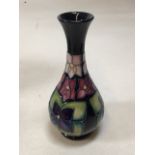 A Moorcroft vase of Baluster form designed by Sally Tuffin. Also with a Lambeth Doulton vase and 2