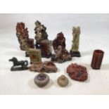 A quantity of oriental soapstone carvings