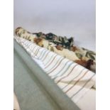 Three rolls of upholstery fabric