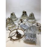 Three gilt metal ceiling lights triple and double tiered with drop lustres and four mirror backed