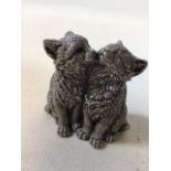 A sterling silver filled figurine of two kittens