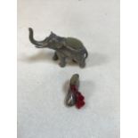 A silver boot pin cushion also with elephant pin cushion in white metal