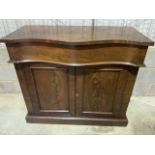 A Victorian flame mahogany chiffioniere with serpentine fronted drawer above cupboard with shelf.