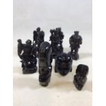 Three carved Aztec style figures possibly obsidian with six oriental carved figures