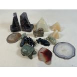 A collection of polished and carved minerals.