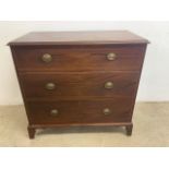 An early 20th century mahogany chest of drawers with three graduated drawers with brass handles. W: