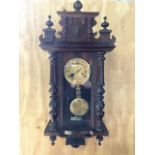 A Vienna wall clock with pendulum. W:40cm x D:16cm x H:85cm