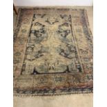 A large antique Persian carpet. W:260cm x H:336cm
