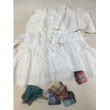 Two vintage baby dresses and 2 petticoats also with vintage hankies and silk squares