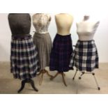 A vintage kilt and plaid skirts with another