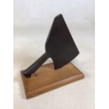 A vintage butchers bone chopper on wooden stand W:22cm x H:26cm