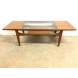 A G Plan style teak mid century teak coffee table with glass centre insert, magazine shelf