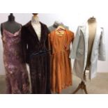 A vintage ladies Mac with an embroidered dress and bolero, a velvet trouser suit and others