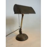A 1920s brass bankers lamp British Patent no 342705. With adjustable head and arm on circular