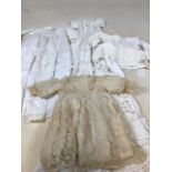 A vintage lace hand sewn lace baby dress lined with silk, also with 2 hand stitched baby chemises