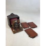 An early twentieth century plate camera - The Sanderson London with three wooden slide holders