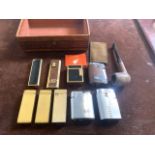 A collection of vintage lighters and a pipe to include: S.J.Dupont Paris lighter ,two gold plated