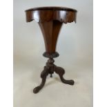 A Victorian walnut veneered pedestal sewing table with contents on carved tripod base. (a.f woodworm