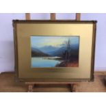 A water colour and gouache painting entitled Sunset on the Lake. Signed lower right G Trevor W: