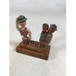 Two vintage circa 1940 Avri bottle stoppers - one with moving hands and one with moving hat