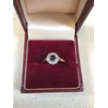 An 18ct gold sapphire and diamond cluster ring, size N/O. Total weight 3gm