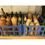Two large crates of Victorian and other glass and stoneware bottles