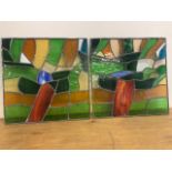 A pair of stained coloured glass square panels. W:51cm x H:51cm