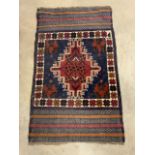 A small Afghan rug. W:132cm x D:79cm x